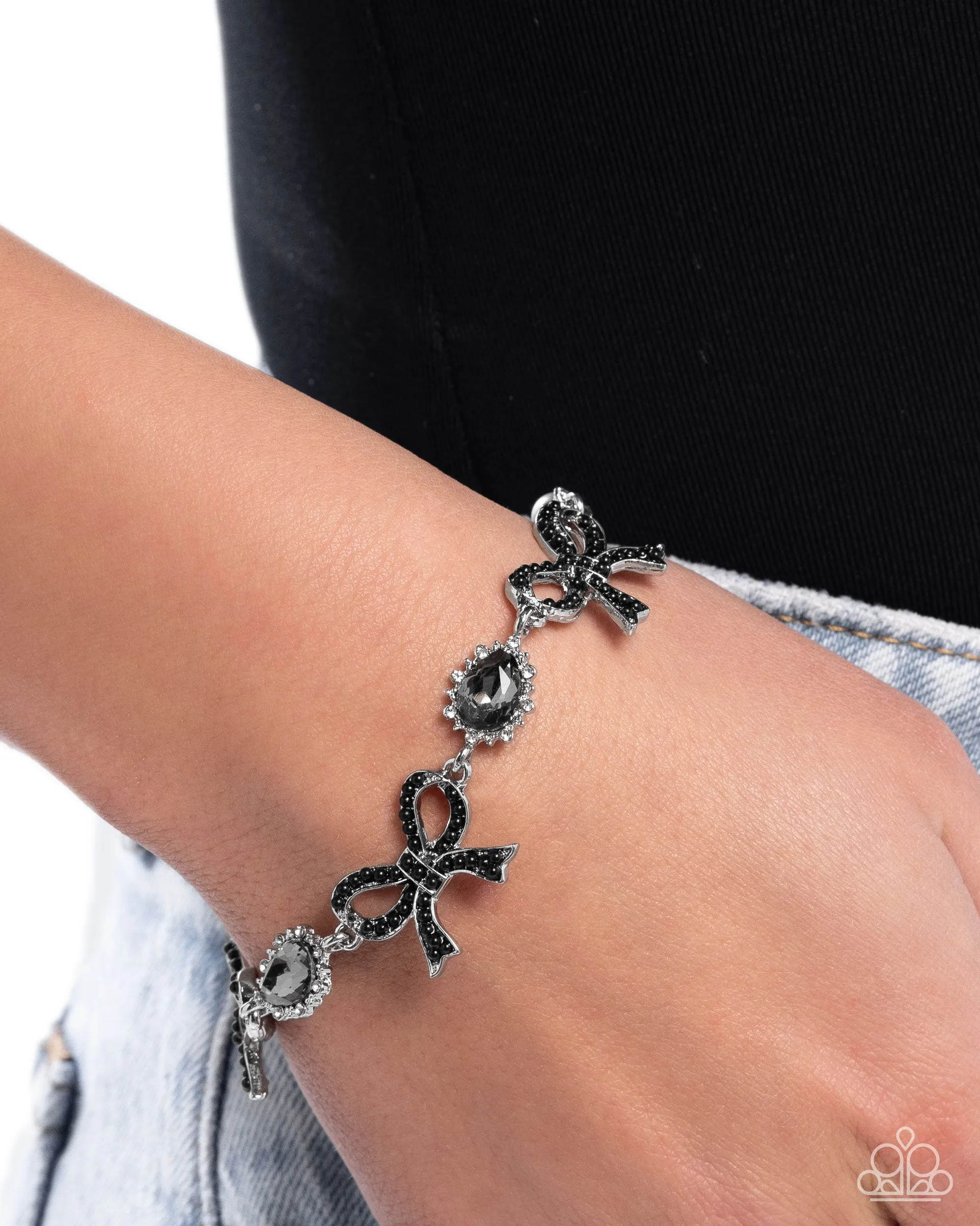 Coquette Caliber - Black - Rhinestone Bow Smoky Teardrop Gem Paparazzi Lobster Claw Bracelet