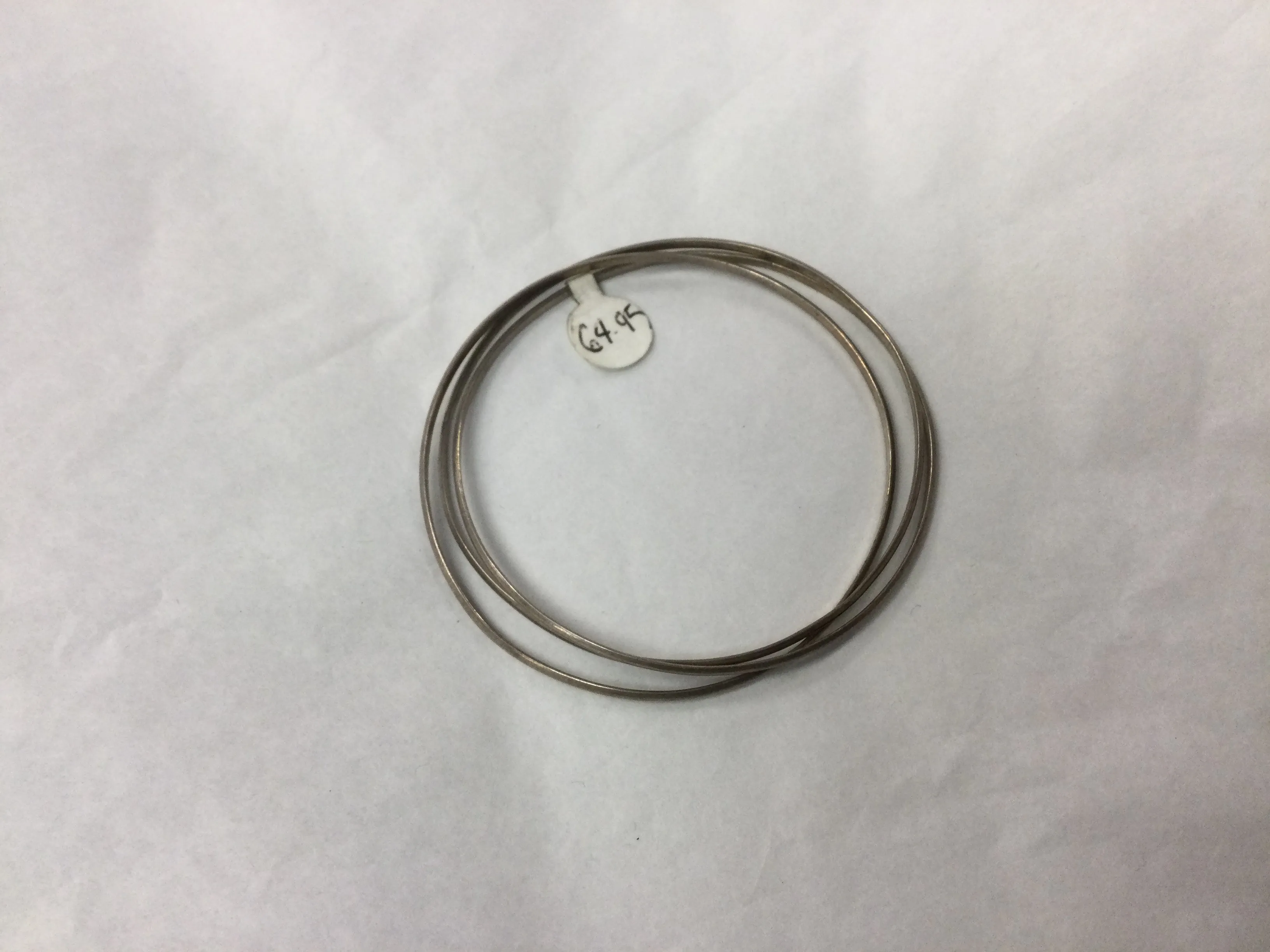 Three Intertwined Silver Bracelets